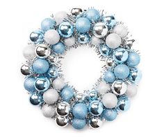 a blue and silver christmas wreath on a white background with ornaments around the wreath, top view