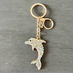 a key chain with a dolphin on it