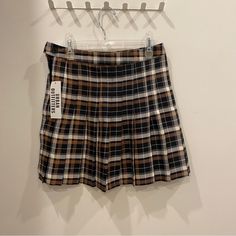 High-Waisted Wrap Skirt From Urban Outfitters In A Mini A-Line Silhouette. Offers A Plaid Finish With Pleated Accents Throughout And Button Closure At The Waist. Urban Outfitters Exclusive. Content + Care. 73% Viscose, 24% Polyester, 3% Spandex Dry Clean Imported Size + Fit. Model Is 5'9" And Wearing Size Small Measurements Taken From Size Medium Length: 17" This Is The Cutest High-Waisted Plaid Pleated Mini Skirt Fit For Any Dark Or Light Academia, Or Any Fall Fit! The Brown Black And Cream Whi Pleated Plaid Skirt, Plaid Pleated Mini Skirt, Urban Outfitters Skirt, Fall Fit, Skirt Fits, Brown Top, School Uniforms, Black And Cream, Light Academia