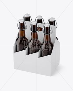 six green beer bottles in a cardboard box on a white background with clippings