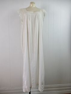 "Vintage 1910s house dress, Edwardian nightgown. Lightweight. Made of white cotton. Has delicate lace trim. No label. Size large. Actual measurements are: 45\" at the bust 49\" at the waist 50\" at the hips 21.5\" shoulder seam to shoulder seam 52\" overall length In very good condition with a small hole in the lace(photo)." 1910s Sleepwear, 1910s House, 1910s Dress, Edwardian Nightgown, Silent Sky, Tinkerbell Costume, Dead Animals, Nightgown Vintage, Nightgown Lace