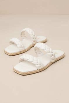 Step into summer with a fresh new look thanks to the Lulus Kennmar Off White Leather Braided Espadrille Slide Sandals! These smooth genuine leather sandals have a comfortable slide-on design, two braided straps, and a square toe bed. Sole is trimmed in beachy jute for a Boho-inspired finish. 0. 5" Rubber heel. Cushioned insole. Rubber sole has nonskid markings. Genuine leather upper. Balance man made materials. Imported. Lulus | Kennmar Off White Leather Braided Espadrille Slide Sandal Heels | S Woven Leather Sandals For Summer, Summer Synthetic Sandals With Woven Leather, Leather Slides For Beach In Summer, Leather Slides For Summer Beach, Leather Slides For Summer Beach Outings, White Woven Leather Sandals For Summer, Leather Sandals For Summer Vacation, Leather Slides For Vacation, Leather Footbed Sandals With Woven Sole For Vacation