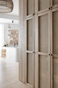 a kitchen with wooden cabinets and white walls