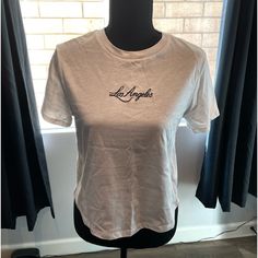 ***Brand New!!*** H&M Los Angeles Crop T-Shirt, Color: White, Size: Small, Materials: 100% Cotton Condition: Brand New, Never Worn Original Price; $10 H&m Crew Neck T-shirt With Letter Print, Trendy H&m Graphic Print T-shirt, H&m Basic Short Sleeve T-shirt, H&m Cotton Crew Neck T-shirt, Basic Short Sleeve T-shirt By H&m, Basic H&m Short Sleeve T-shirt, H&m Casual White T-shirt, White H&m T-shirt Crew Neck, H&m White Graphic Print Tops