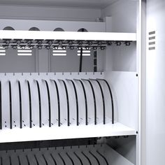 a white shelf filled with lots of black and white items