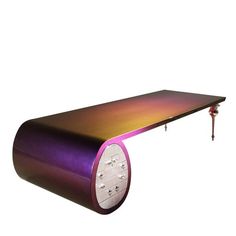 a table that has some sort of device on it's end and is purple