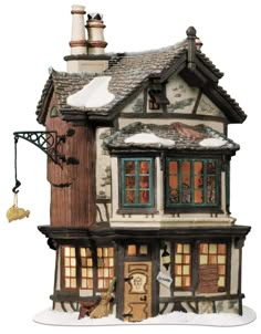 a doll house with lots of windows and snow on the ground in front of it