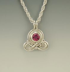 "P738- Sterling Silver Pendant with a 8 mm Blush Topaz with a Pink Ribbon design. Has a Sterling Silver 18 \" 3 mm Rope chain with Lobster Claw clasp. Pendant measures: 31 mm L from the top of the bail x 25 mm W. It is made using the Lost wax method of casting, where I made the design in wax and then cast it into silver. To learn more about this process and Me please visit my website at: www.denimanddiamondsjewelry.com Thanks for stopping by, come back often, I have a lot more to list. Patti" Metalwork Jewelry, Artisan Bracelets, Casting Jewelry, Ribbon Design, Original Jewelry, Pink Blush, Blue Chalcedony, Silver Pendants, Etsy Jewelry