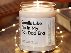 a candle that reads smells like i'm in my cat dad era