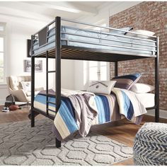 a bunk bed with blue and white striped blankets on it's bottom shelf, in a bedroom