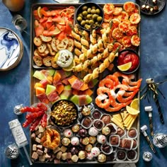 a platter filled with different types of appetizers and snacks on a table