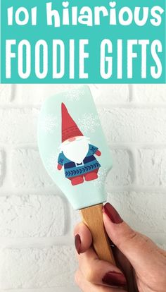 a hand holding a spatula with the words 101 hilarious foodie gifts on it