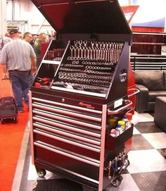 a large toolbox with many tools in it on display at a trade fair or show