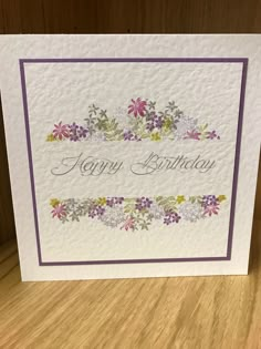 a birthday card with flowers on it