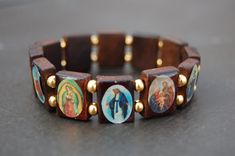 "Saints Bracelet,Catholic Christian Bracelet,Wood Bracelet,Jesus,Mary,Angels Saints Wood Beads,Bronze Beads,Man,Woman,Stretch The bracelet in the picture shown is 7\" size which fits an average wrist, please select your size from the drop down menu at checkout I will custom make your order, any questions please feel free to contact message me anytime, thank you very much. * * * * * * * * * * * * * * * * * * * * * * * * * * * * * * * * * * Choosing Sizes: Sizes are actual wrist measurement, not t Saints Bracelet, Jesus Bracelet, Christian Bracelets, Wood Bracelet, Unusual Jewelry, Wood Beads, Picture Show, Turquoise Bracelet, Jewelry Bracelets