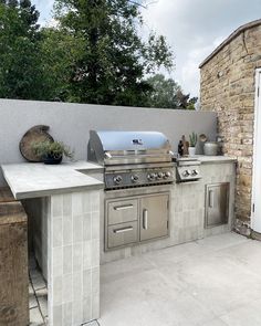 an outdoor kitchen with stainless steel appliances