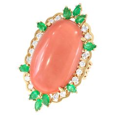 A stunning and unusual vintage 1960's 35.56 carat coral, 2.20 carat emerald and 0.86 carat diamond, 15 karat yellow gold combination dress ring and pendant; part of our diverse vintage jewellery and estate jewelry collections. This stunning, fine and impressive vintage gemstone ring/pendant has been crafted in 15k yellow gold. This substantial ring is ornamented with a feature four-claw set 35.56ct oval cabochon cut coral. The feature stone is encompassed with a paralleling scalloped border inco Luxury Elegant Coral Rings, Combination Dresses, Gemstone Rings Vintage, Coral Pendant, Coral Ring, Dress Rings, Precious Gemstones, Round Cut Diamond, Vintage Jewellery