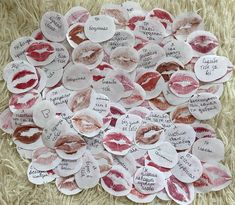 a pile of paper hearts with lipstick imprints on them