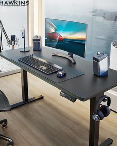 a computer desk with a monitor, keyboard and mouse sitting on it's side