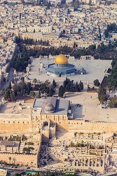 an aerial view of the dome of the rock in the middle of the old city