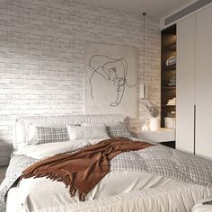 a bedroom with white brick walls and a large bed in the center, along with an art piece on the wall