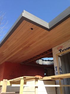 a house under construction with the roof up