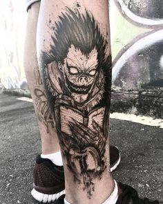 a man's leg with a tattoo on it that has a drawing of a demon riding a skateboard