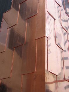 the side of a building that has been painted copper