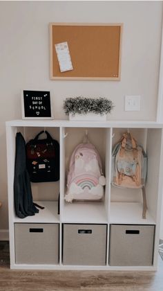 a white shelf filled with different types of bags