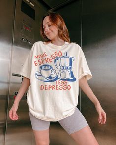 Perk up your style with this vintage-inspired tee! Featuring the playful phrase "More Espresso, Less Depresso," it's the perfect pick-me-up for coffee lovers with a sense of humor. We use professional quality DGT printing on all our apparel. Direct-to-garment, or DTG, is a high quality printing method that sprays ink directly onto the garment so there is no peeling or cracking. This fabulous graphic will be printed on a Comfort Colors Unisex T-Shirt. Please refer to the size charts in the images Vintage Aesthetic Coffee, More Espresso Less, Funny Coffee Shirts, Graphic Tee Vintage, Retro Graphic Tees, Coffee Lover Gift, Coffee Shirt, Coffee Tshirt, Aesthetic Coffee