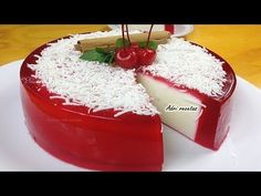 a red and white cake is on a plate