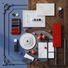 an overhead view of a dining room table with red and white decorations on it, including apples