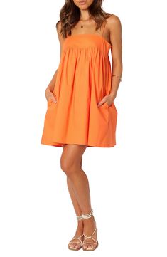 Cotton poplin in a summery shade adds sunshine-ready style to this shift dress popped with handy pockets at the sides. Slips on over head Square neck Adjustable straps Side-seam pockets Unlined 100% cotton Hand wash, line dry Imported Orange Gameday Outfit, Light Orange Dress, Auburn Gameday Outfit, Orange Sun Dress, Auburn Gameday, Cruise Fits, Orange Clothes, Orange Summer Dress, Created Colorful