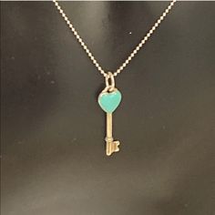 This Is An Authentic Tiffany Sterling Silver Enamel Heart Key Pendant Necklace Tiffany Blue. This Necklace Features A Sterling Silver Heart Shaped Key Accented With Tiffany Blue Enamel On A Sterling Silver Bead Chain. This Is A Stunning Necklace With A Distinctive Look Only From Tiffany! Excellent Condition/Comes With A Pouch. Tiffany Blue Key Necklace, Key Pendant Necklace, Heart Key, Heart And Key, Bead Chain, Necklace Blue, Key Pendant, Silver Bead, Stunning Necklace