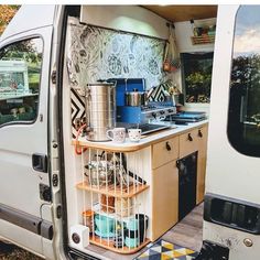 the kitchen area of an rv is neatly organized and ready to be used as a camper