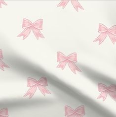 pink bows on white fabric background