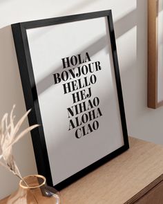 a black and white poster with the words hola bonjo hello hej niao aloha ciao