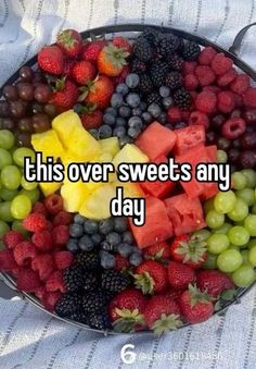 a bowl full of fruit with the words this over sweets any day