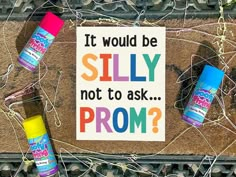 a sign that reads, it would be silly not to ask prom? with three spray bottles