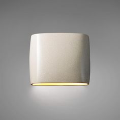 a white wall light on a gray background