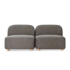 two grey couches sitting next to each other