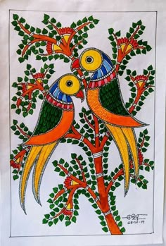 two colorful birds sitting on top of a tree