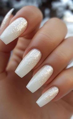 White Glitter Nails With Designs, White Nails Glitter Accent, White Glitter Acrylics, White Nails With Black Glitter, White Gold Glitter Nails, Sparkling White Nails, White Nails With White Glitter, Halloween Elegant Nails, White Sparkle Ombre Nails