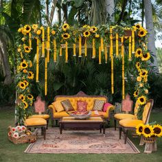 an outdoor seating area decorated with sunflowers