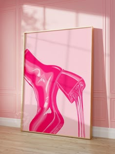 a pink abstract painting hangs on the wall