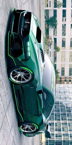 a green sports car parked on the side of a building