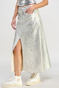 Experience a modern twist on timeless glamour with our exquisite Front Slit Metallic Midi Skirt. Crafted from denim silver, it boasts a high-rise waist with belt loops, front zipper and button closure, and two front and back pockets. A chic front slit adds sultry allure, while a clean hem gives it a sophisticated finish. A must-have for any fashionista's wardrobe. Metallic Midi Skirt, Tulle Ruffles, Timeless Glamour, Column Skirt, Stretch Denim Fabric, Winter Closet, Metallic Skirt, Pleated Skirts, Metallic Fabric