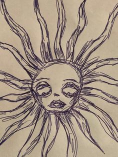 a drawing of a sun with eyes drawn on paper