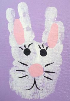 a hand painted like a bunny on a purple background