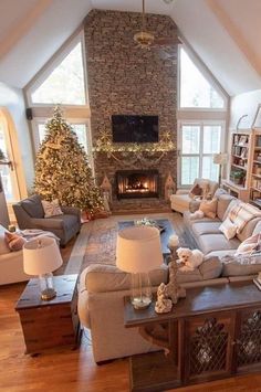 a living room filled with furniture and a fire place in the middle of a room